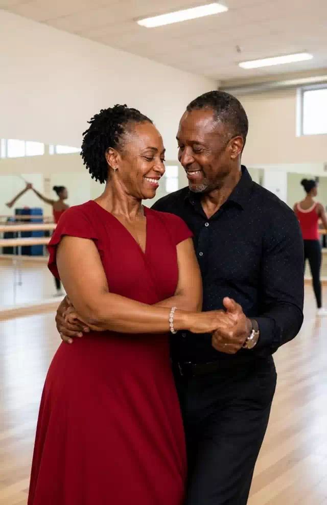 A couple dancing on studio floor performing the hammerlock